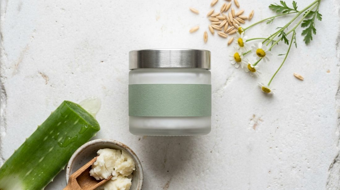 Skincare jar with ingredients laid out