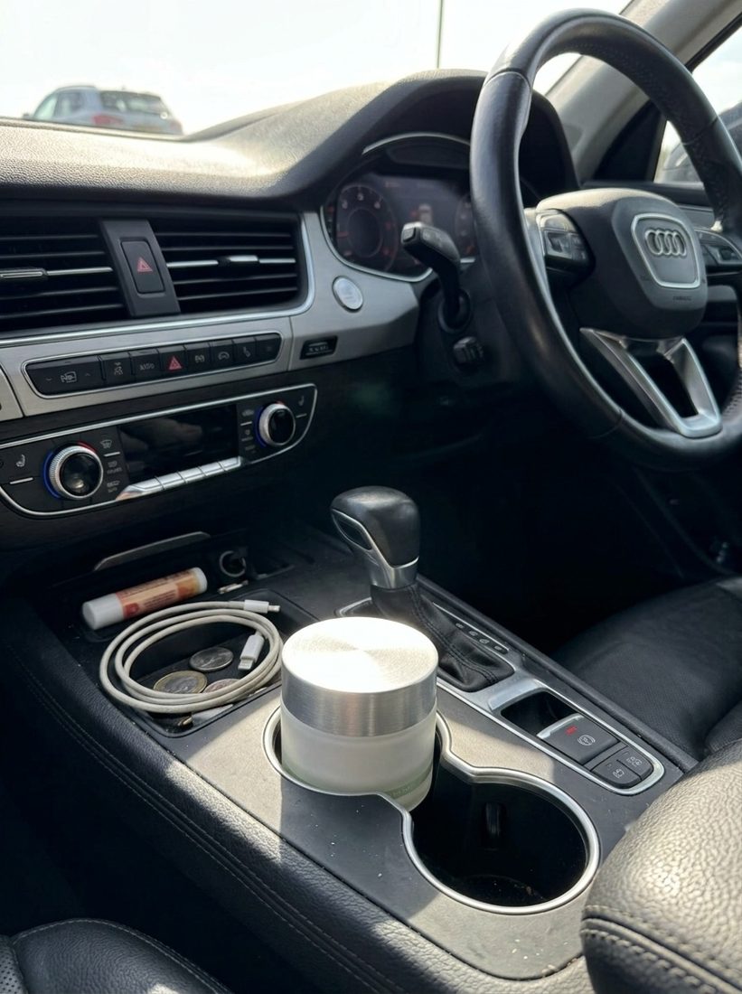 Skincare jar in a car cupholder